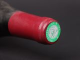 a close up of a bottle of wine on a table