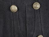 a close up of a military coat with buttons on it