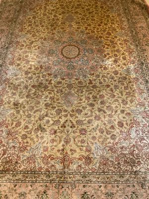 an image of a large oriental rug on a wooden floor