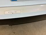a picture of a car with a sticker on it ' s bumper