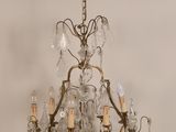 a chandelier that has a lot of glass hanging from it