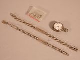 two watches and a bracelet on a table