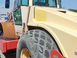 a picture of a construction vehicle parked in a parking lot