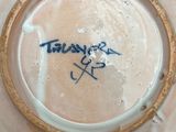 a white plate with a blue writing on it