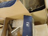 a box of electronic equipment sitting on top of a pile of boxes