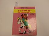 un livre rose avec l'image d'un cow-boy à cheval