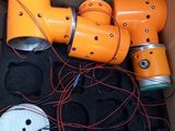 a box with a bunch of orange robots inside of it