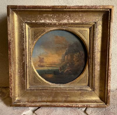 une vieille photo représentant un tableau représentant un coucher de soleil, dans un cadre doré