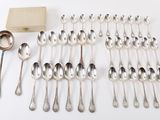 a lot of spoons and a box on the table