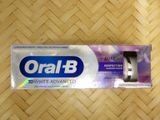 oral b toothpaste in a box on a wooden surface