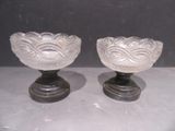 two glass bowls sitting on top of each other