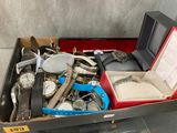 a box full of watches and other watches on display