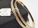 a close up of two bang bracelets with a tag on it