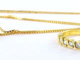Ensemble collier et bague plaqués or jaune, sertis de pierres en cristal transparent