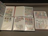 a lot of different stamps on the pages of a book