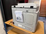 a machine that is sitting on a shelf in a room