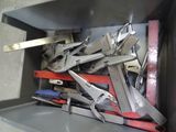 a box full of tools that are sitting on the floor