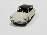 a toy car that is sitting on a white surface