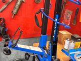 an image of a mechanic ' s workshop with tools on the wall