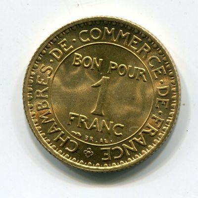 l'image d'une pièce d'or sur laquelle figure l'image d'un homme