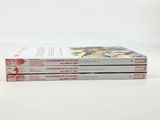 three books sitting on top of each other on a table