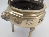 brass incense burner with lion heads on legs and feet