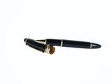 a pen that is laying on top of a piece of paper