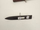 a knife and a knife holder on a table