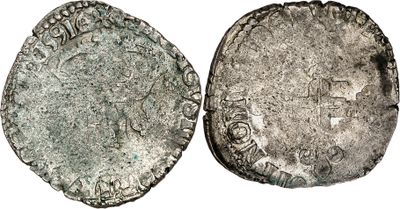 une pièce d'argent portant l'image d'un homme