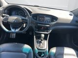 the interior of a small car with a steering wheel and dashboard