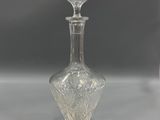 a close up of a clear glass bottle on a table