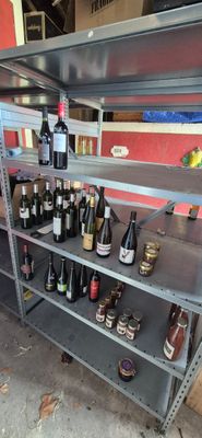 many bottles of wine on the shelves in the store