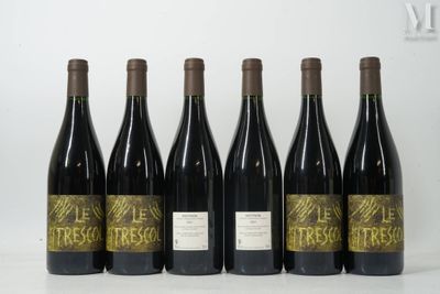 six bottles of wine are lined up in a row on a table