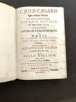 a book open on a table with a black background