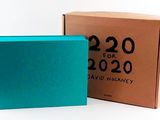 a blue box and a brown box sitting next to each other