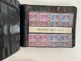 a black case with a lot of stamps inside of it