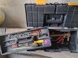 a tool box with tools in it sitting on the ground