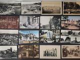 many old photos of a city on display on the wall