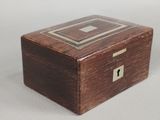 a small wooden box that has a lock on it