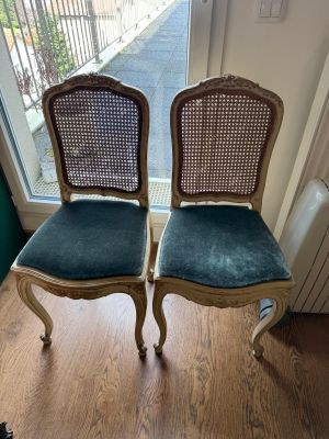 two chairs sitting next to each other on a hard wood floor