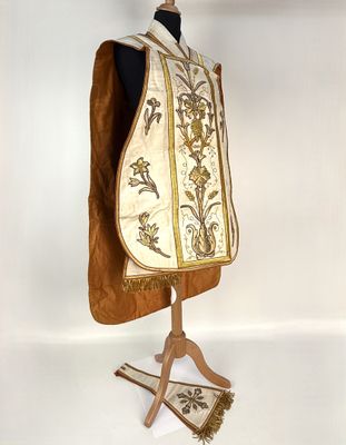 an image of a white and gold vest on a mannequin