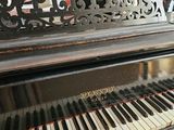 a black piano that is sitting on a table