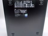 the back of a laptop with a battery on top of it