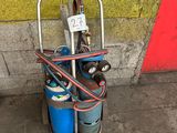 a cart with two cylinders and a hose attached to it