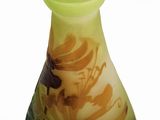 a vase that has a yellow and black design on it