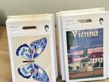 two books sitting on top of a wooden table next to each other