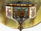 a gold and blue box sitting on top of a table