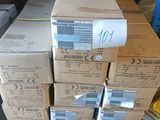 many boxes stacked on top of each other in a warehouse