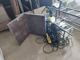 a picture of a room with a bunch of wires and a table