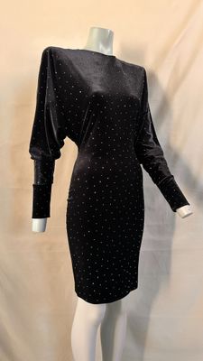 black velvet dress with white polka dots on the shoulders